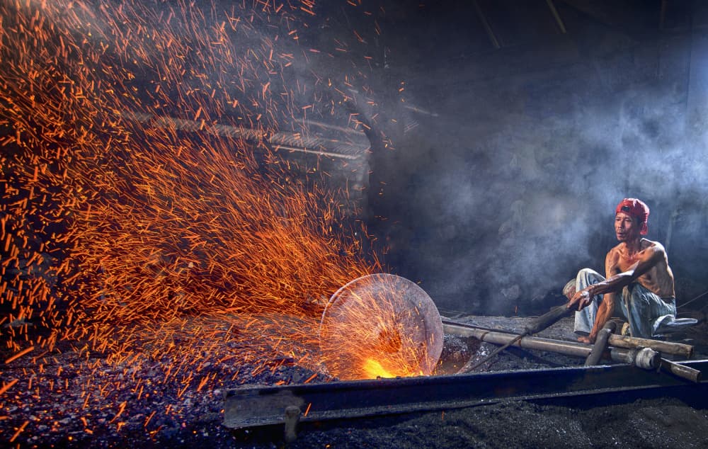 Forge Man Sparks Glow by Angela Muliani Hartojo — canvas wall art