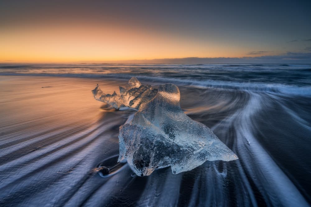 Glowing Ice on Black Sand by Adam Pachula — canvas wall art
