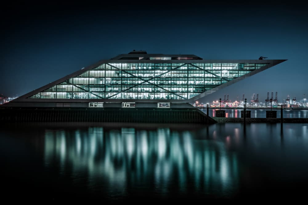 Modern Building Night Reflections by Jürgen Muß — canvas wall art
