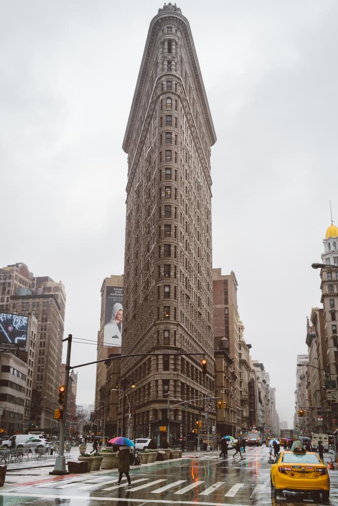 Flatiron Building Rainy Day by Bethany Young — canvas wall art