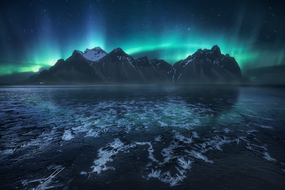 Aurora Peaks Reflection by Carlos F. Turienzo — canvas wall art