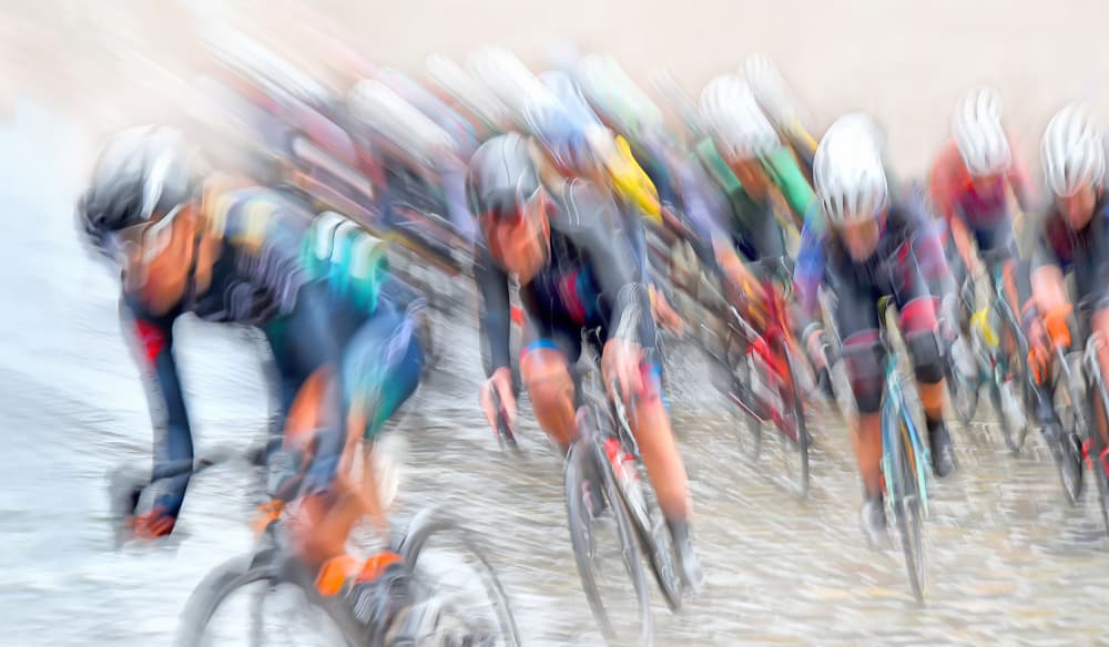 Racing Cyclists Blur by Lou Urlings — canvas wall art