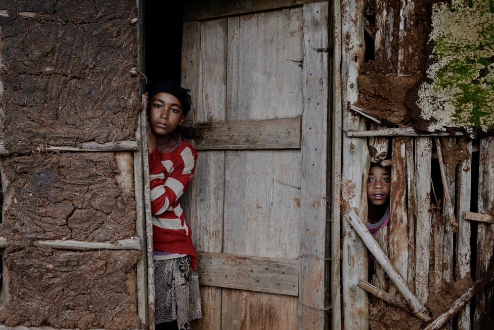 Rural Children Peeking Out by Mohammed Al Sulaili — canvas wall art