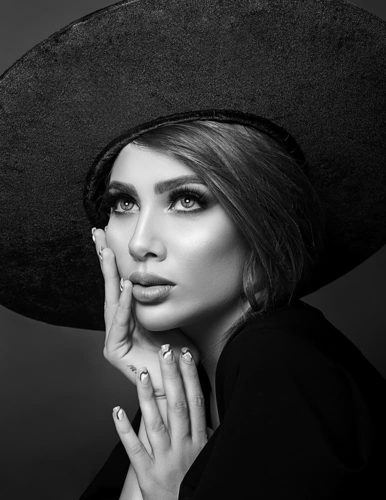 Elegant Woman Black Hat by amir behzadi — canvas wall art