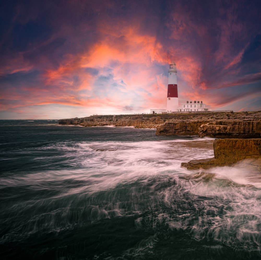 Dramatic Coastal Lighthouse Sunset by Jean Vandijck — canvas wall art