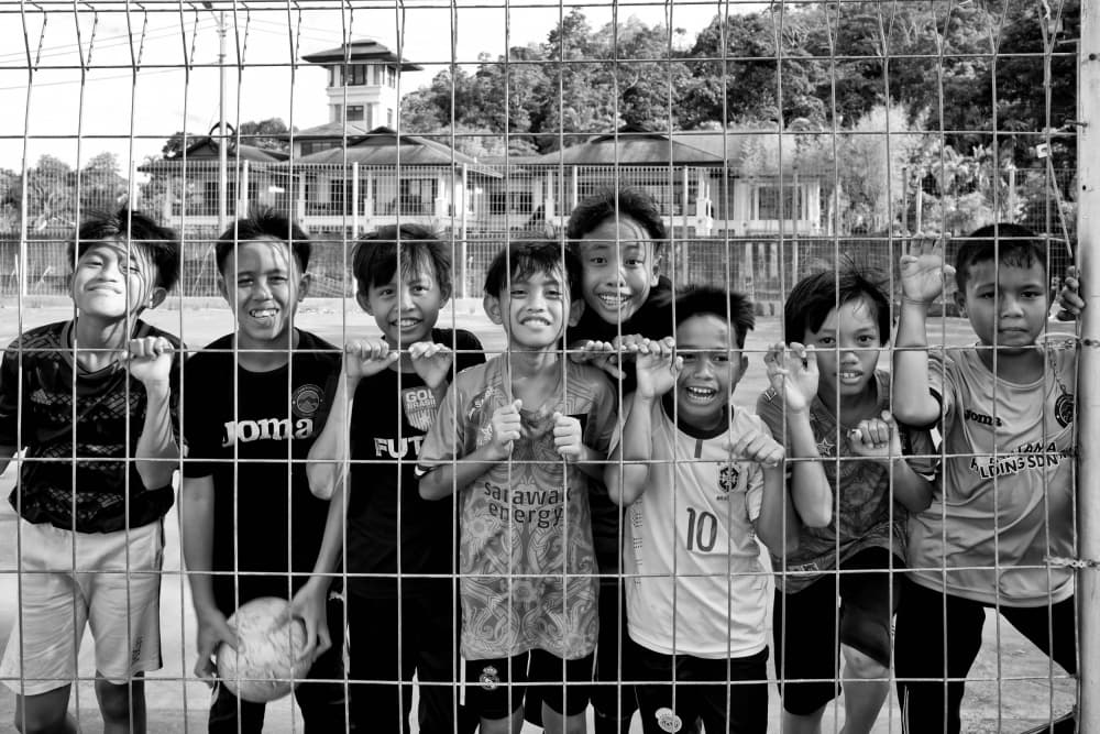 Smiling Soccer Friends by Kieron Long — canvas wall art