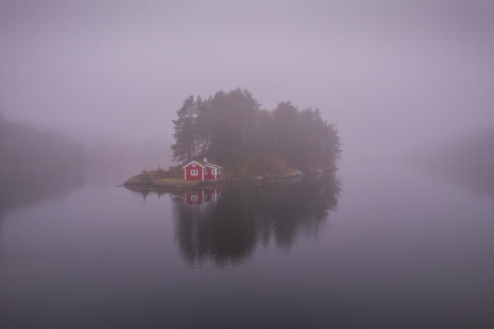 Red Cabin Island Fog by Rune Askeland — canvas wall art