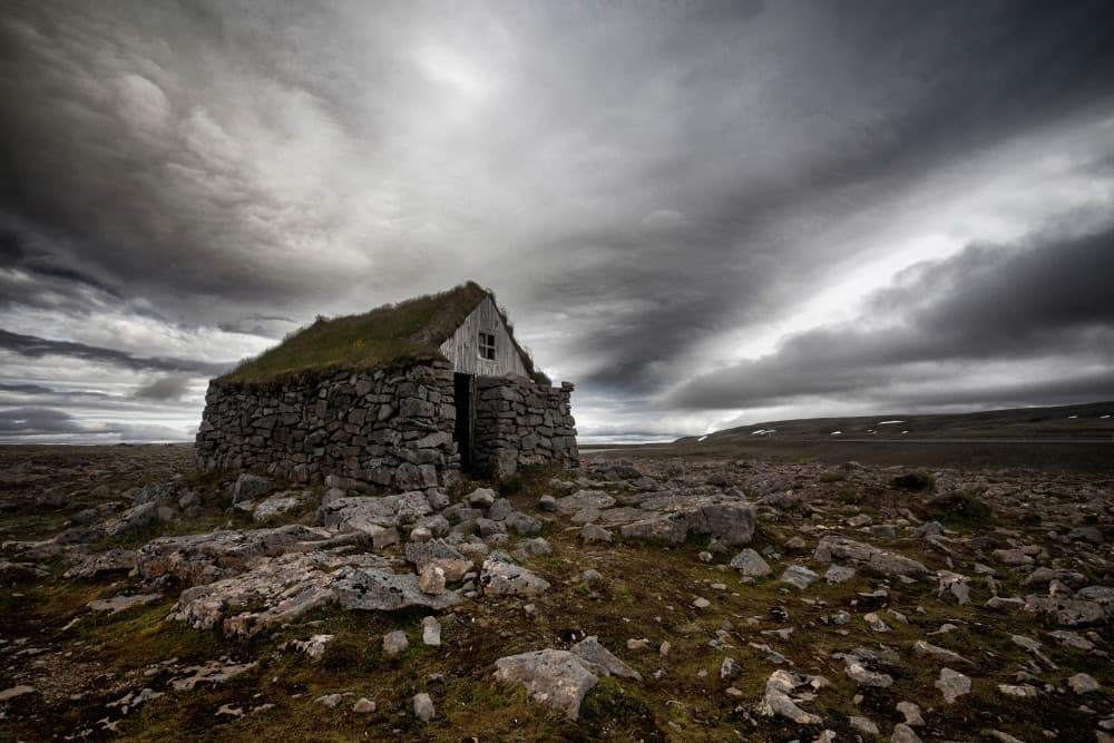 Dramatic Sky Stone Cabin by Þorsteinn H. Ingibergsson — canvas wall art