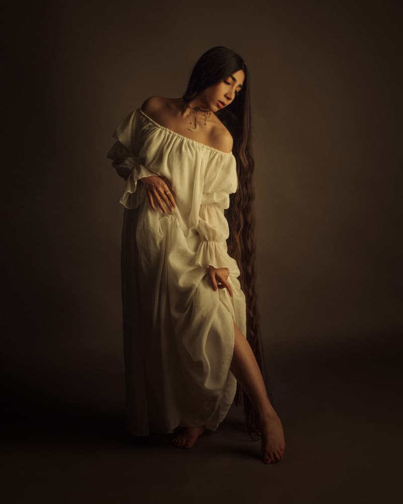 Pensive Woman White Dress by Mehdi Mokhtari — canvas wall art