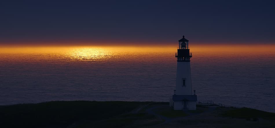 Lighthouse Sunset Glow by Vadim Balakin — canvas wall art