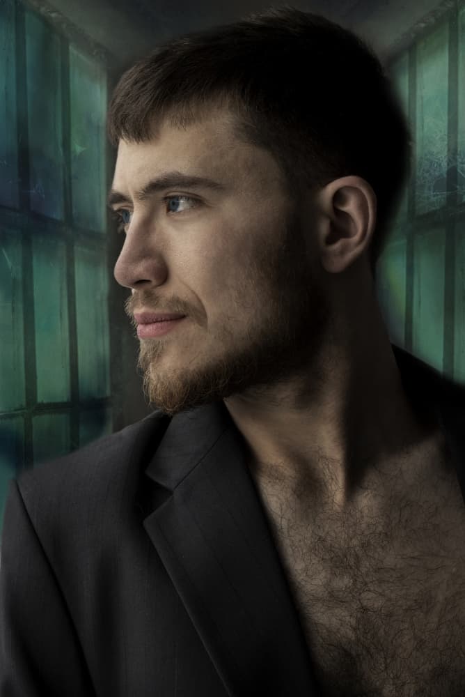 Thoughtful Man Green Background by Ewa Całkosińska-Kajzer — canvas wall art