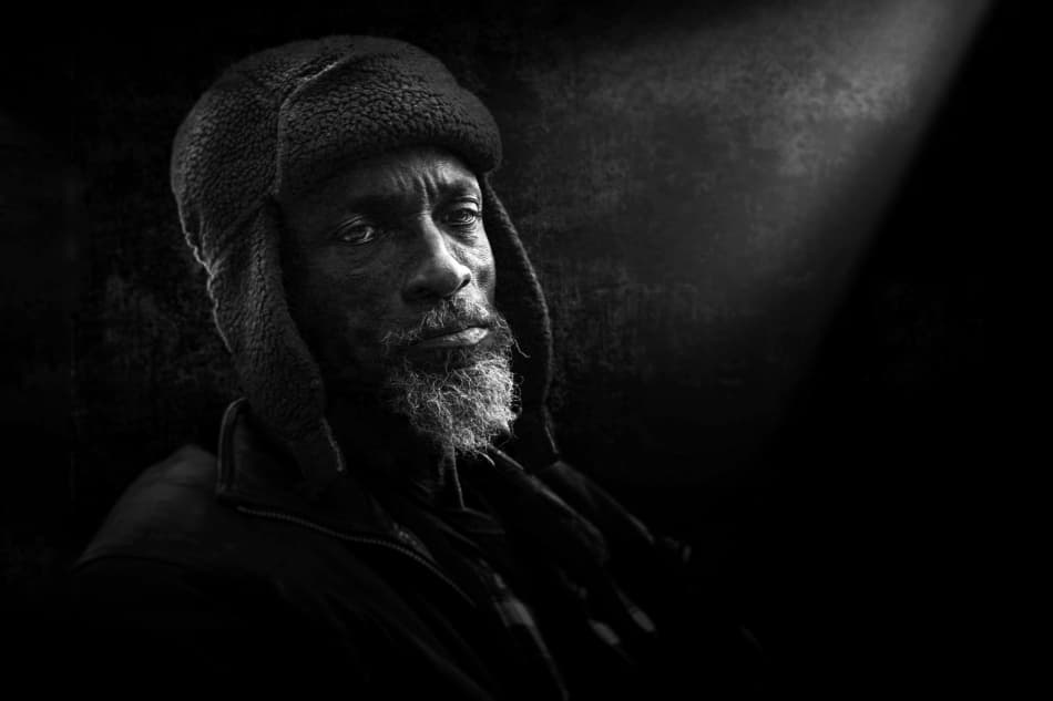 Pensive Man Winter Hat by Mohammed Baqer — canvas wall art