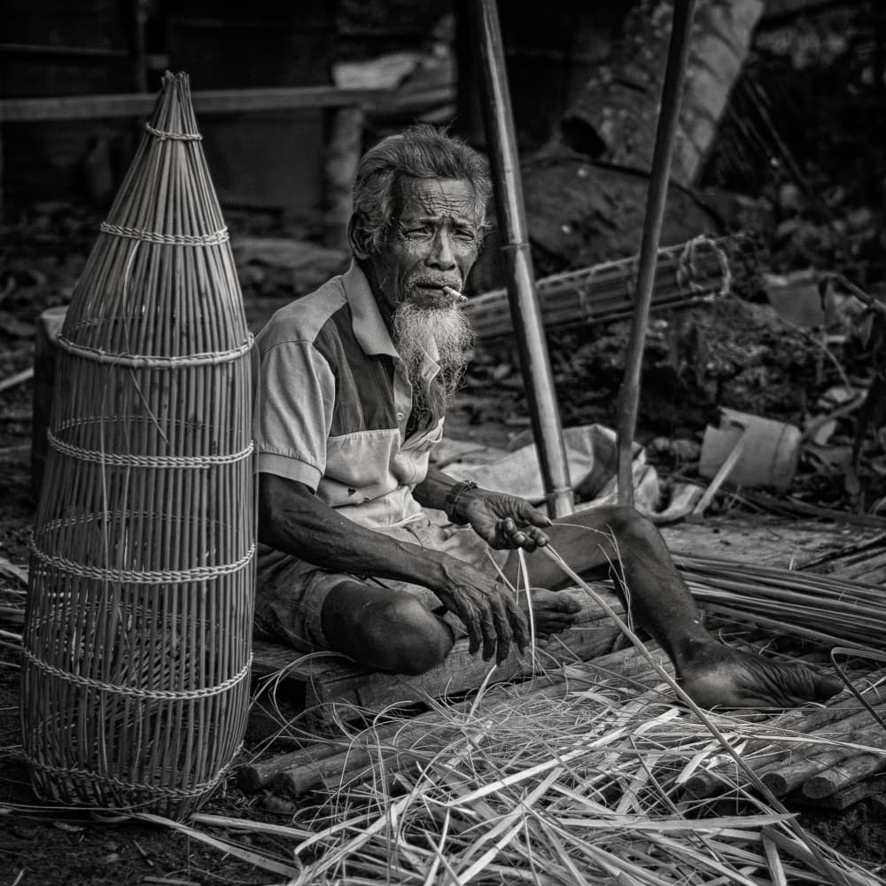Elder Craftsman Weaving Bamboo by Hafiz Ismail — canvas wall art