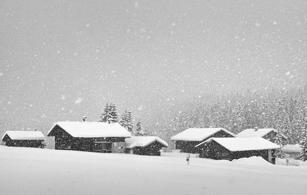 Snowy Winter Cabins by Uschi Hermann — canvas wall art