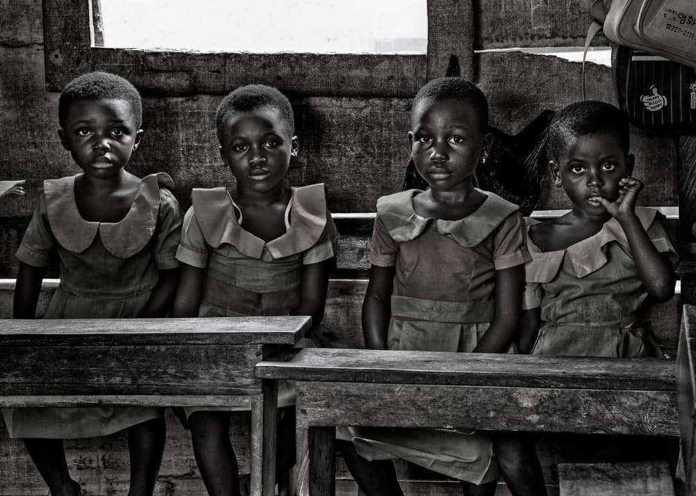 African Schoolgirls Gaze by Joxe Inazio Kuesta Garmendia — canvas wall art