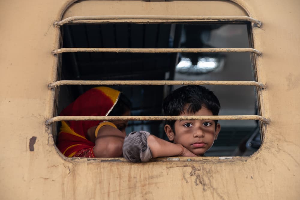 Pensive Boy Train Window by Ilana Lam — canvas wall art