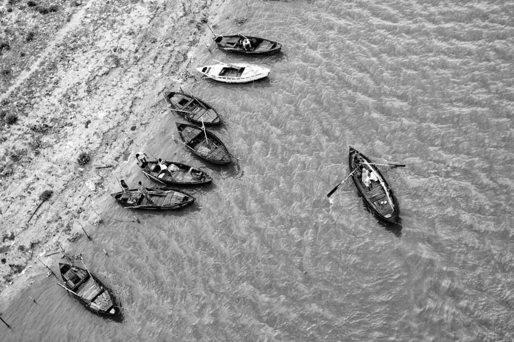Boats Along the Shore by Shaibal Nandi — canvas wall art