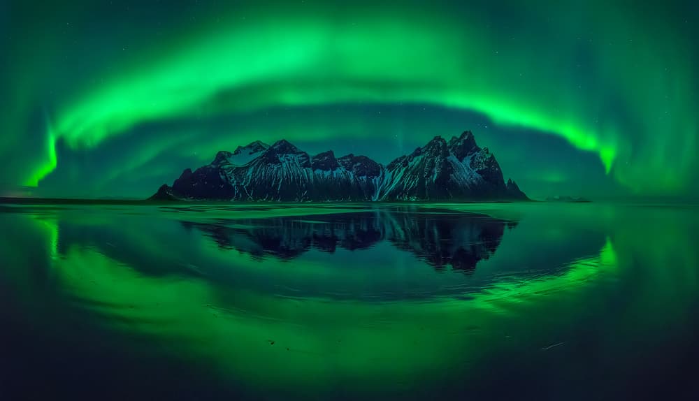 Green Aurora Mountain Reflection by Wojciech Kruczynski — canvas wall art