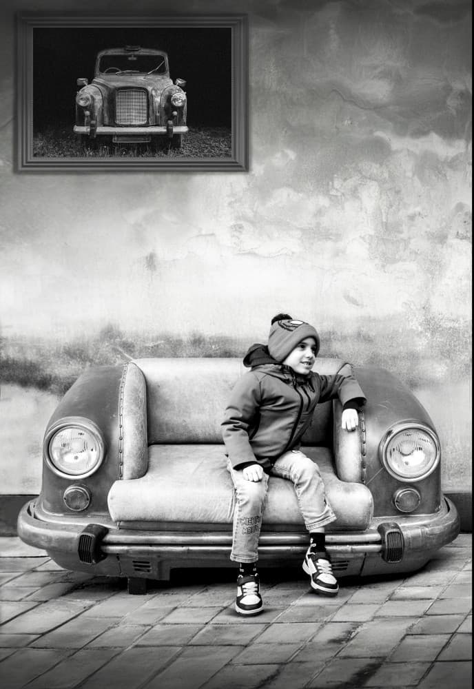 Child on Vintage Car Sofa by Giorgio Toniolo — canvas wall art