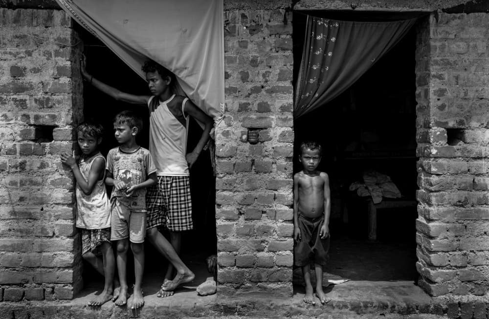 Village Children at Doorway by Prithul Das — canvas wall art