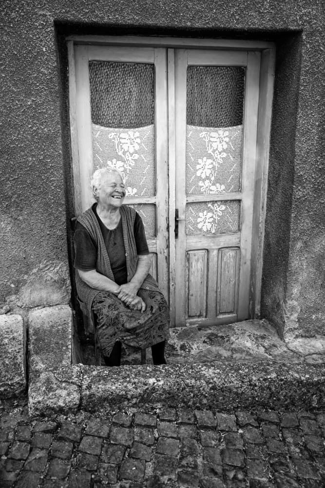 Joyful Woman Doorway by Cicek Kiral — canvas wall art