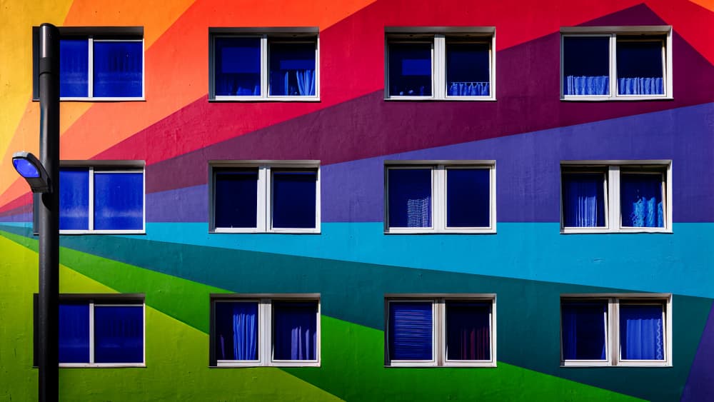 Colorful Rainbow Building by Jürgen Muß — canvas wall art