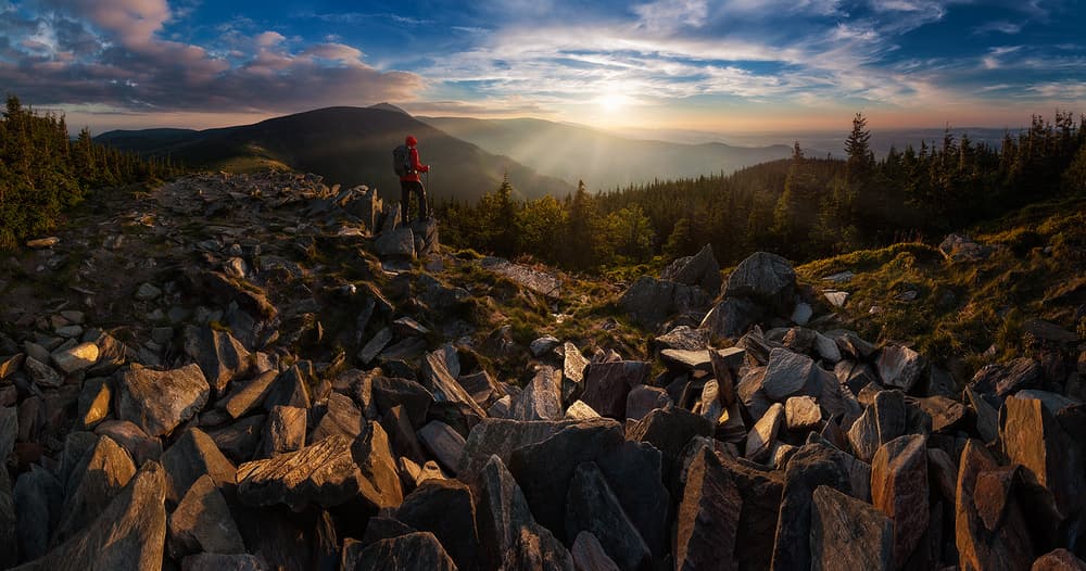 Hiker Overlooking Mountain Sunset by Lucjan Stoszko — canvas wall art