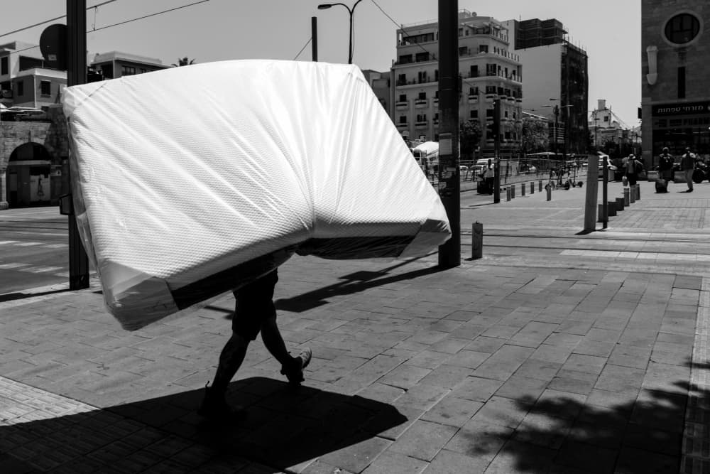 Carrying a Mattress by Corinne Spector — canvas wall art