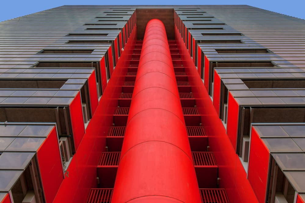 Dynamic Red Building by Theo Luycx — canvas wall art