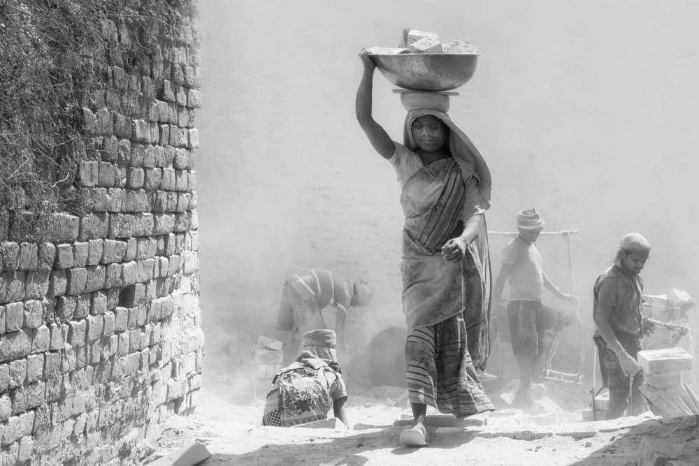 Woman Carrying Bricks by Emel Sefer — canvas wall art