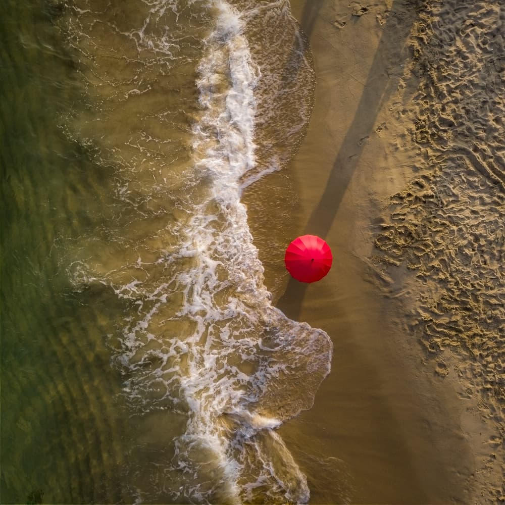 Solitary Beach Umbrella by Chiranjib Chakraborty — canvas wall art