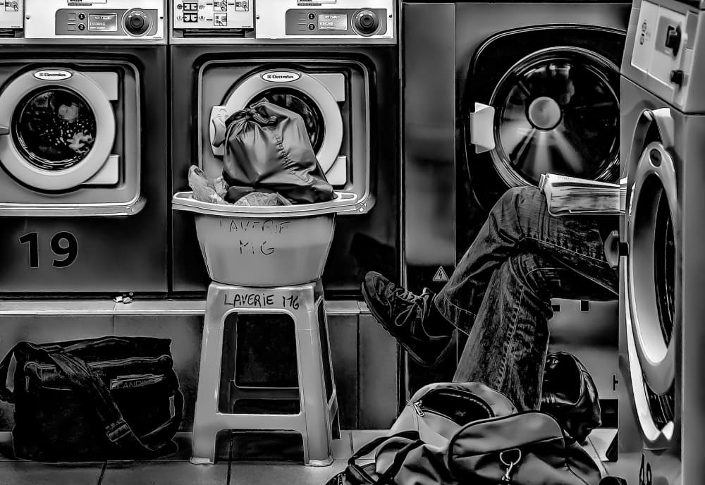Laundromat Waiting Game by Rodrigo Marin — canvas wall art