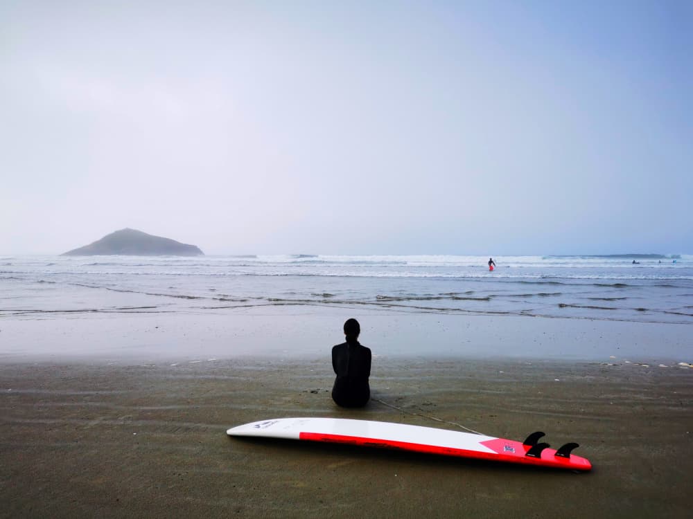 Misty Beach Surfer by Jasmine Zhang — canvas wall art