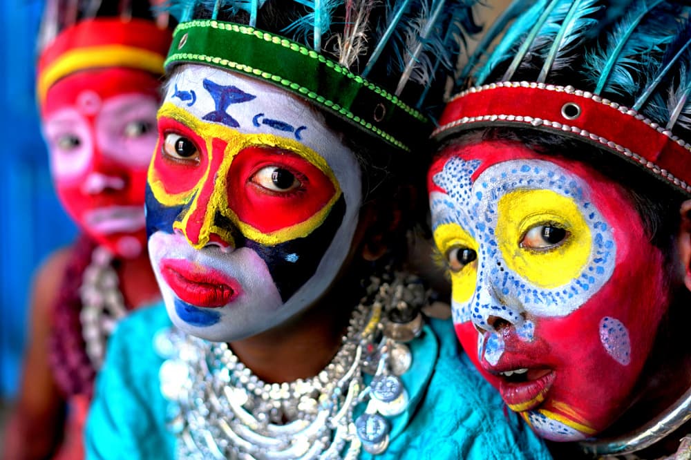Vibrant Painted Faces by Avishek Das — canvas wall art