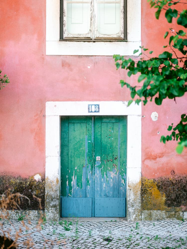 Little door in Lisbon by Raisa Zwart — canvas wall art