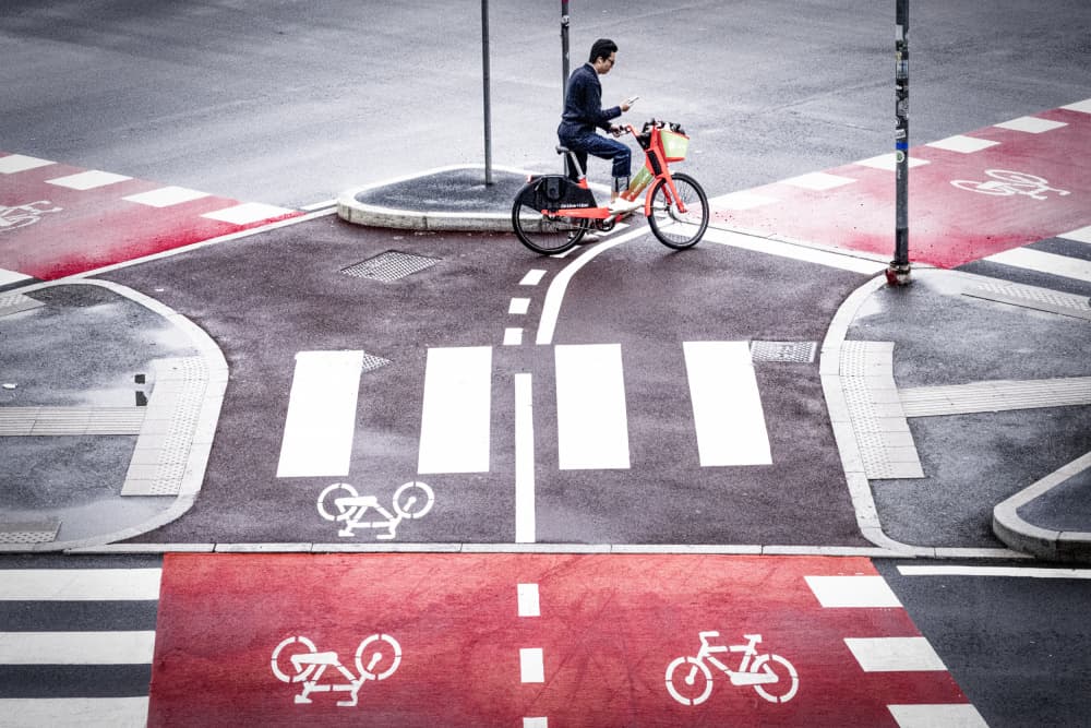 Urban Cyclist Crossing by Linda Wride — canvas wall art