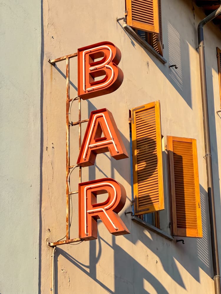 Warm Sunlit Bar Sign by Andreas Magnusson — canvas wall art