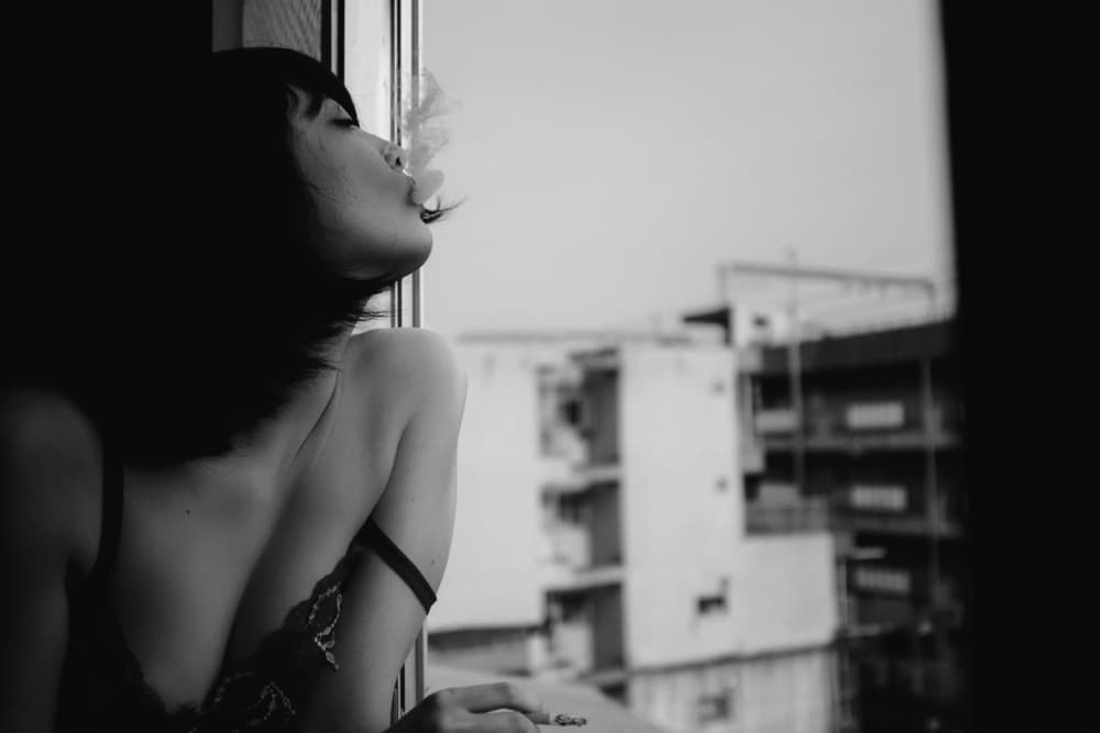 Pensive Woman City Smoke by Takaaki Ishikura — canvas wall art