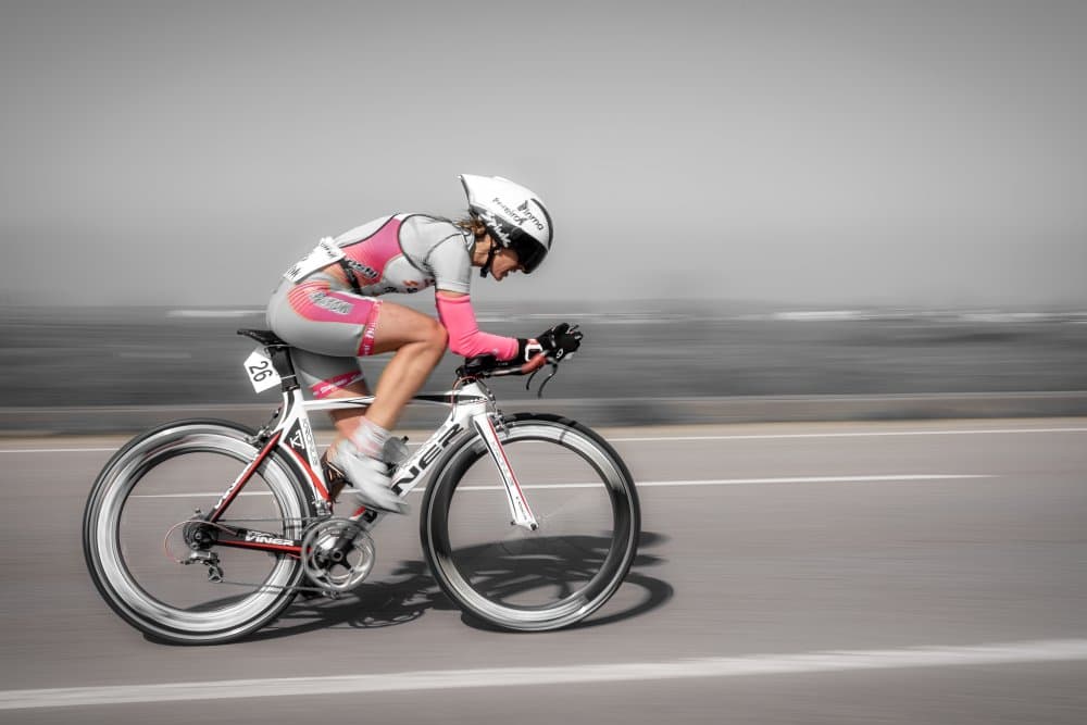Speeding Female Cyclist by Jesus Concepcion Alvarado — canvas wall art