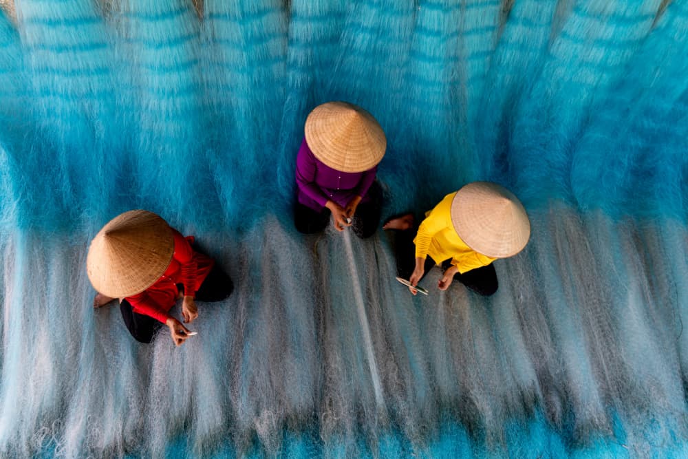 Vibrant Net Weavers by Tran Van Truong — canvas wall art