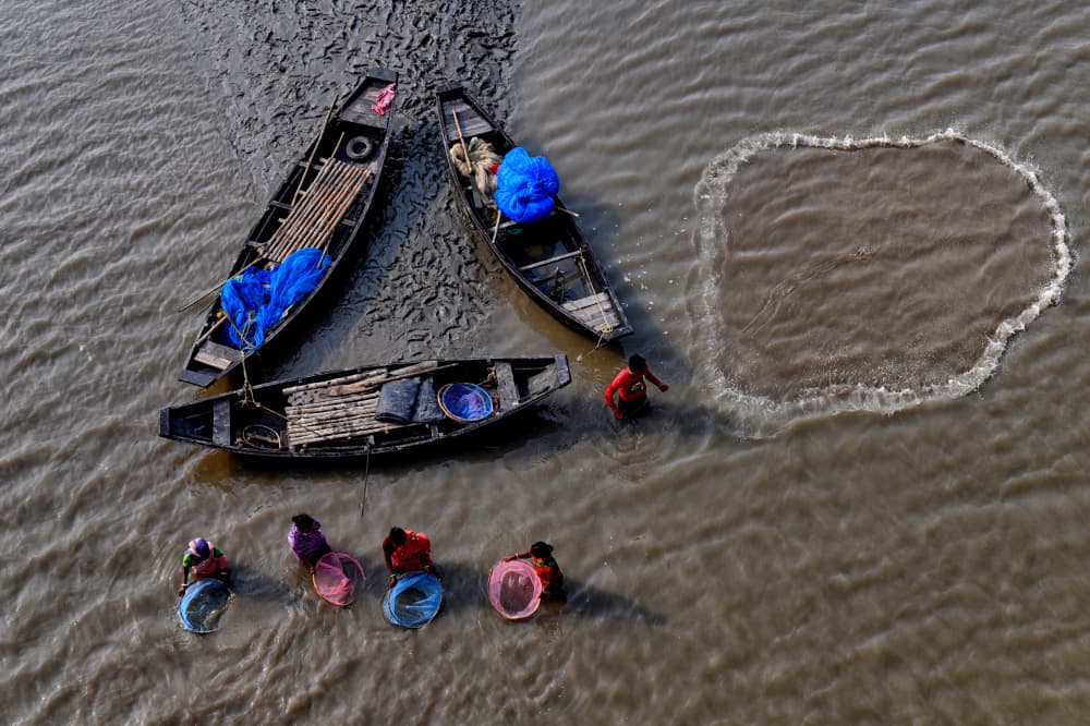 River Fishing Women by Avishek Das — canvas wall art