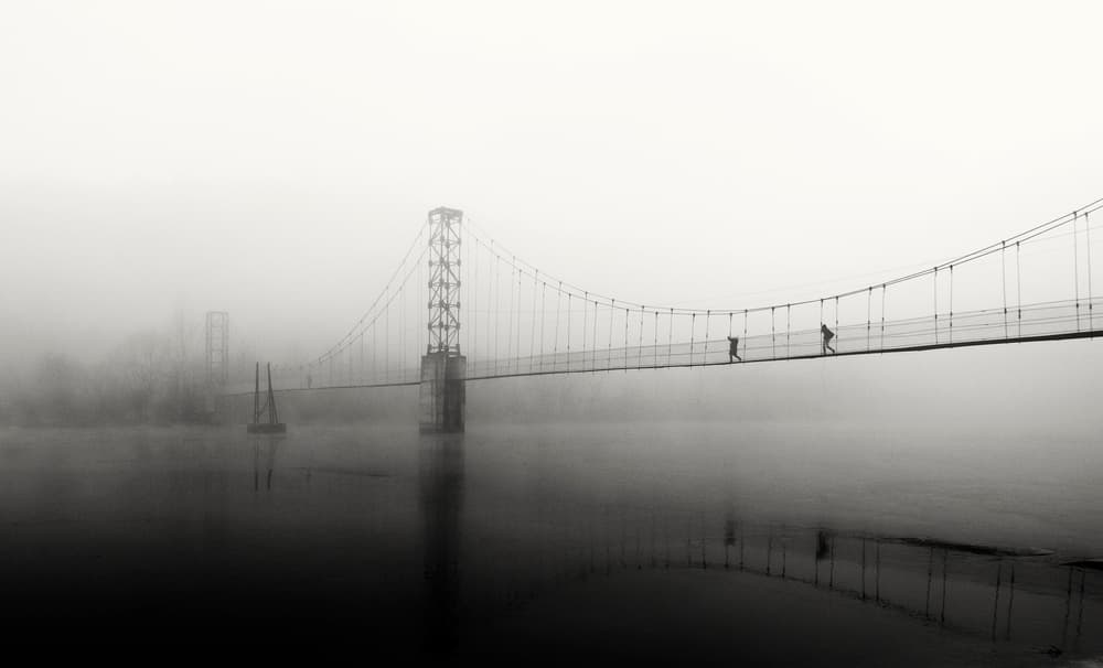 People Crossing Misty Bridge by Julien Oncete — canvas wall art