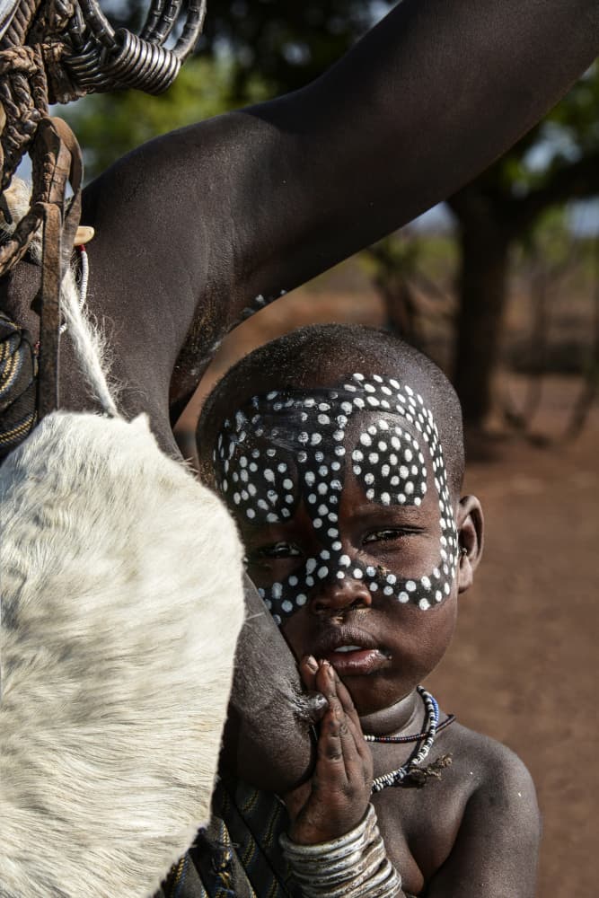 Tribal Child Face Paint by Irene Perovich — canvas wall art