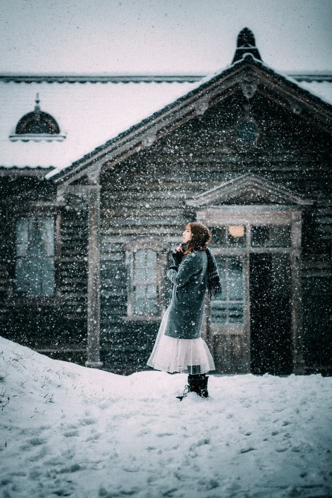Woman in Falling Snow by Nobu Ishijima — canvas wall art