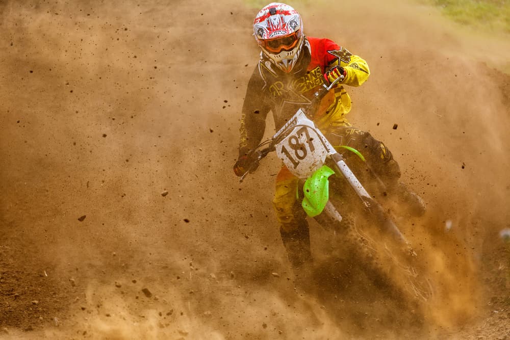 Dusty Motocross Action by Carlos Gonzalez — canvas wall art