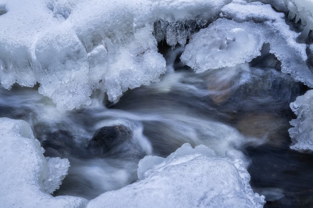 Frozen River Flow by Ludwig Riml — canvas wall art