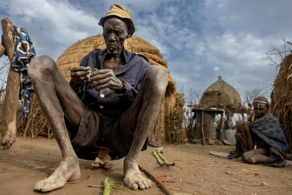 African Elder Village Life by Ella Waldman — canvas wall art