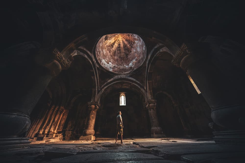 Man in Ancient Church Light by Marco Tagliarino — canvas wall art