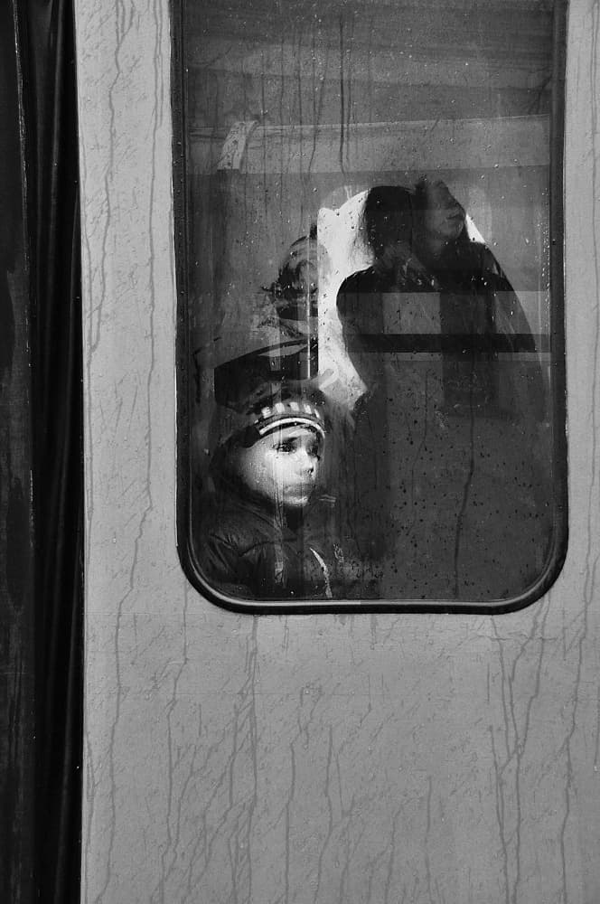 Pensive Child on Train by Nicoleta Gabor — canvas wall art