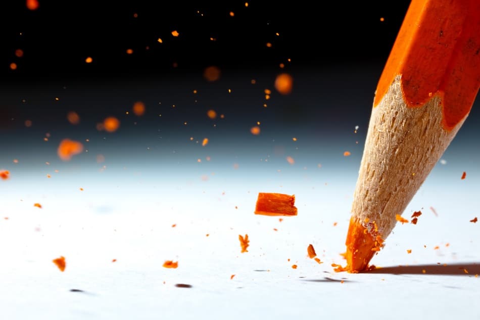 Orange Pencil Breaking by Christophe Kiciak — canvas wall art